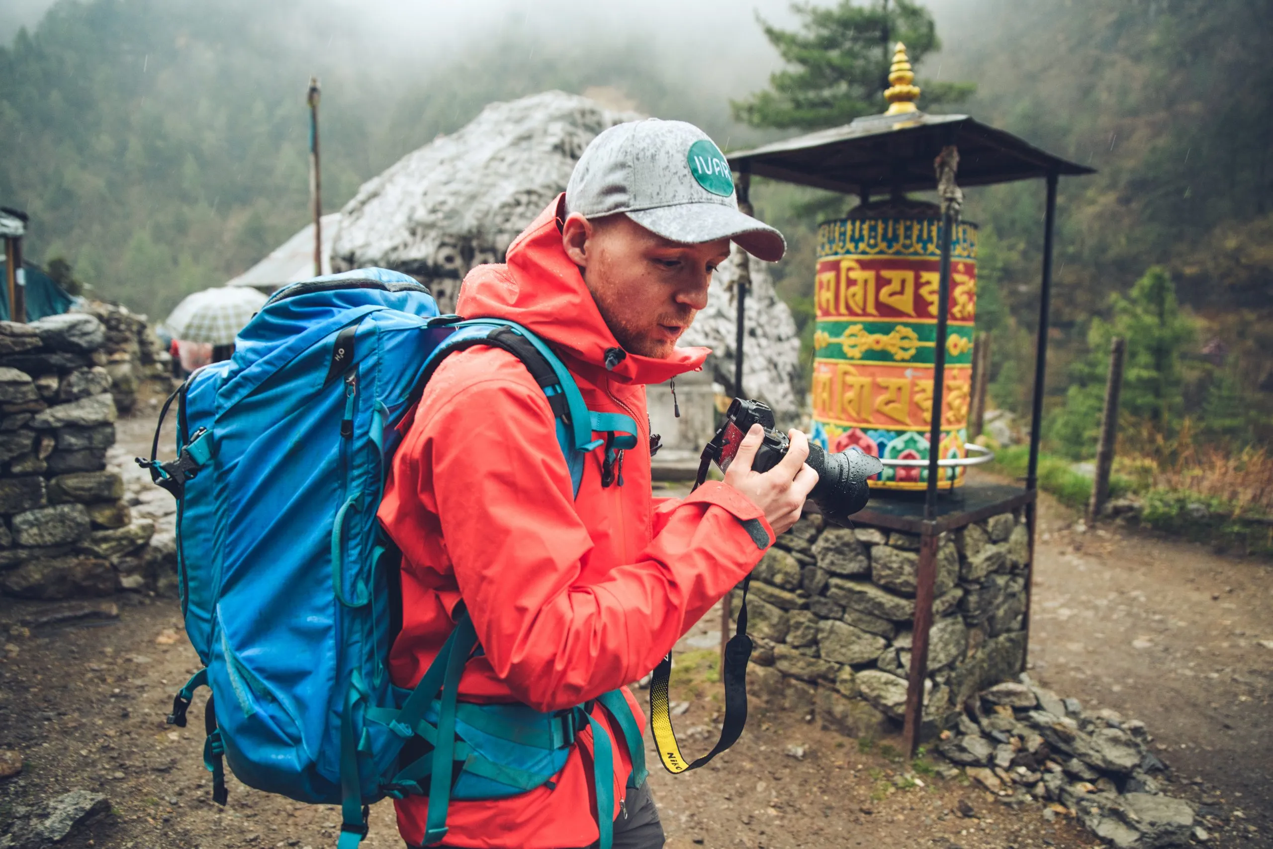 Martin Edström holding a camera in Nepal.