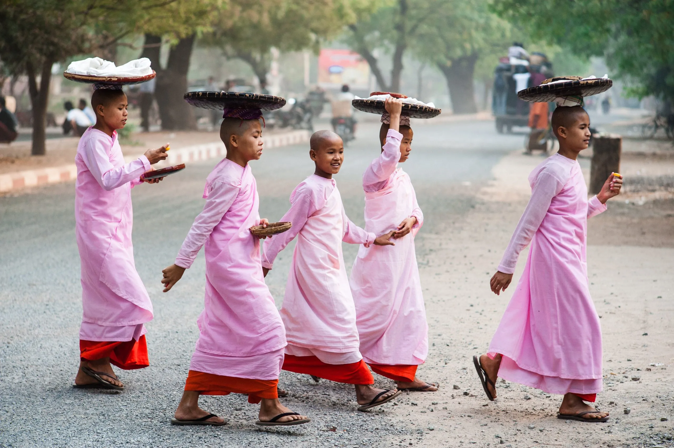 A monk walks through a gilded temple in Burma, where streets teem with the saffron of Buddhist monks and nuns.