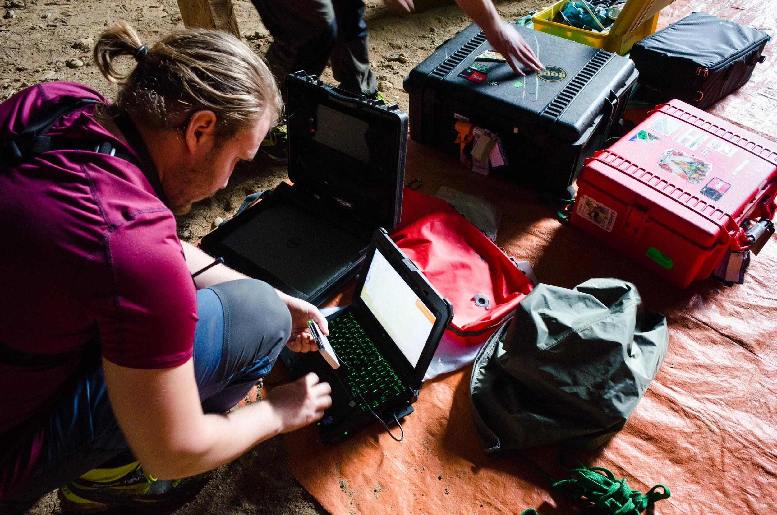 Reviewing captures by laptop inside the cave.